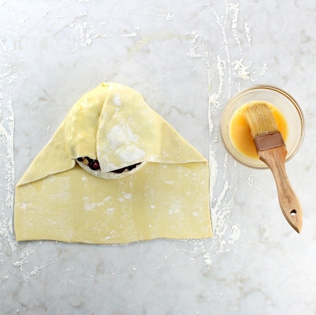 Pastry folded over Brie before baking