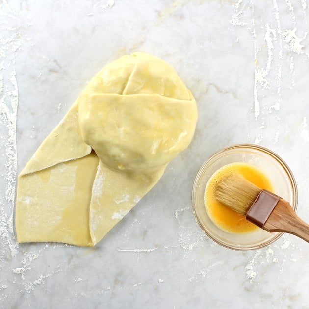 Pastry folded over brie before baking