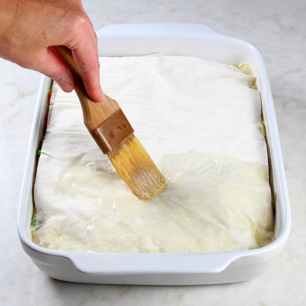 Lighter Turkey Pot Pie - Image of phyllo dough being brushed with olive oil