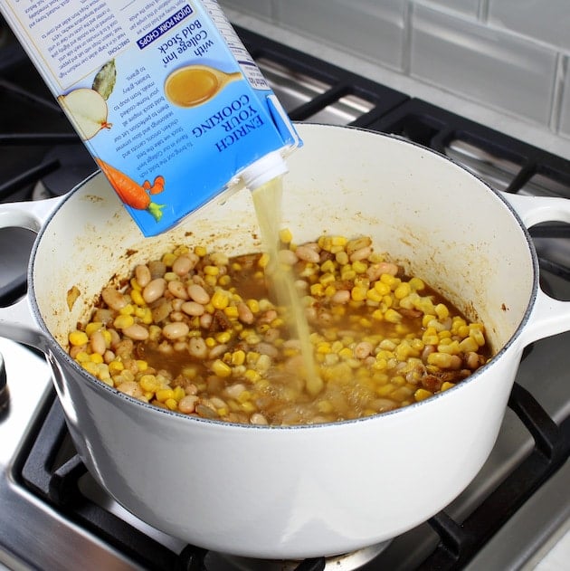 Creamy White Chicken Chili with Great Northern Beans Recipe &amp; Image: adding stock to chili