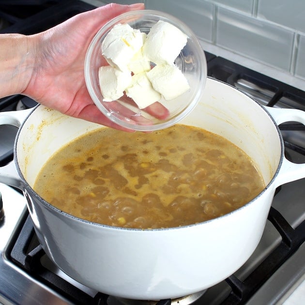 Creamy White Chicken Chili with Great Northern Beans Recipe &amp; Image: adding cream cheese to chili