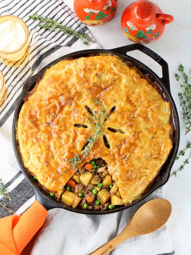 Pot pie with puff pastry in cast iron skillet