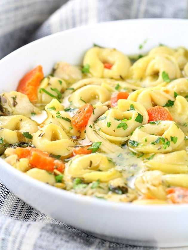 A bowl of Tortellini and chicken soup