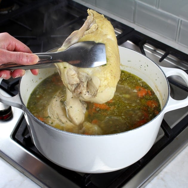 How to make Creamy Tortellini Soup with Chicken - ccoked chicken over soup pot