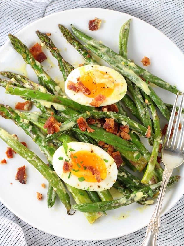 Asparagus Egg and Bacon Salad with Dijon Vinaigrette Image - on a plate.