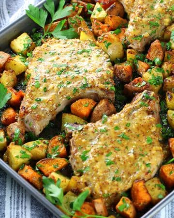 Baked pork chops with mustard sauce on a sheet pan