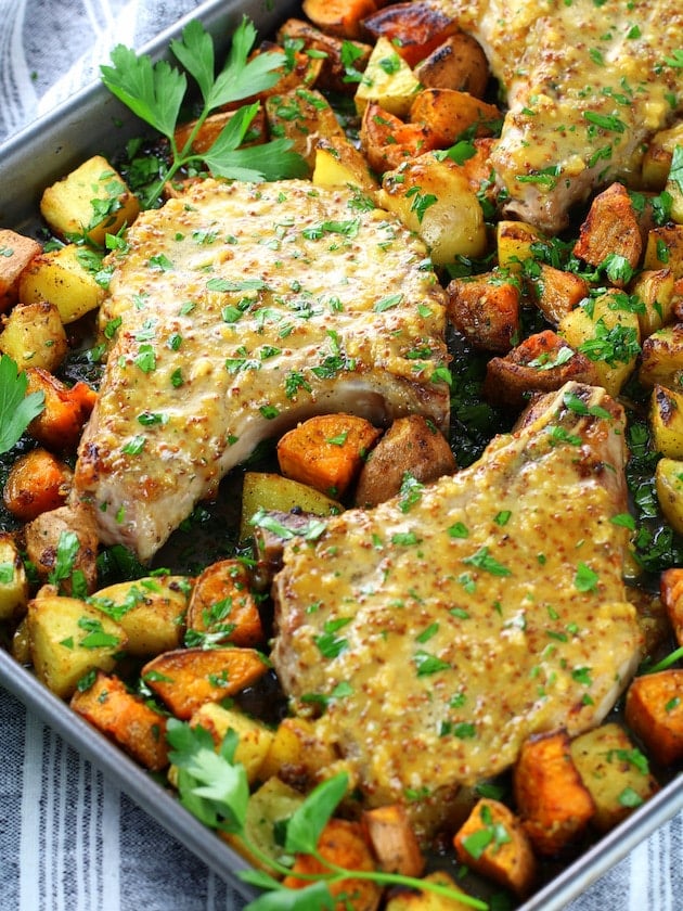 Baked pork chops with mustard sauce on a sheet pan