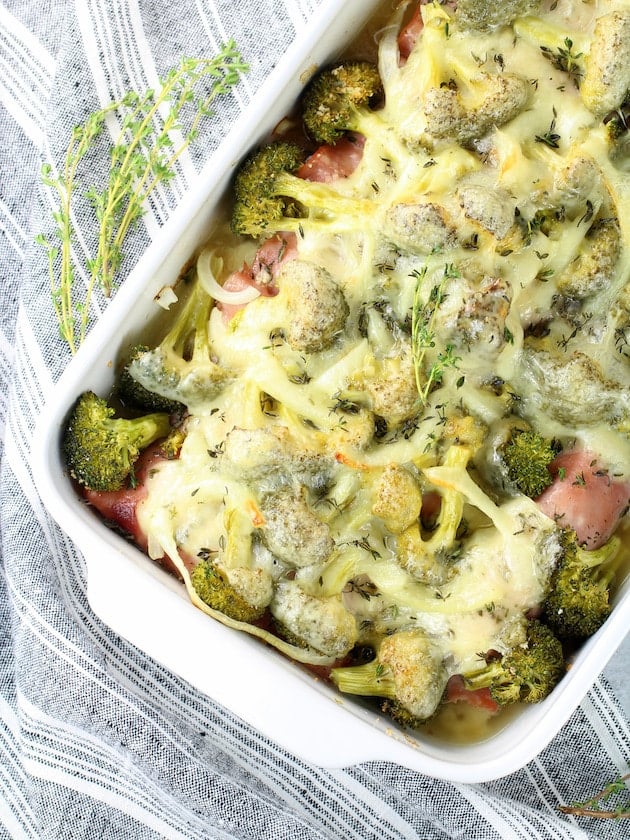 Casserole dish of broccoli with chicken and cheese.