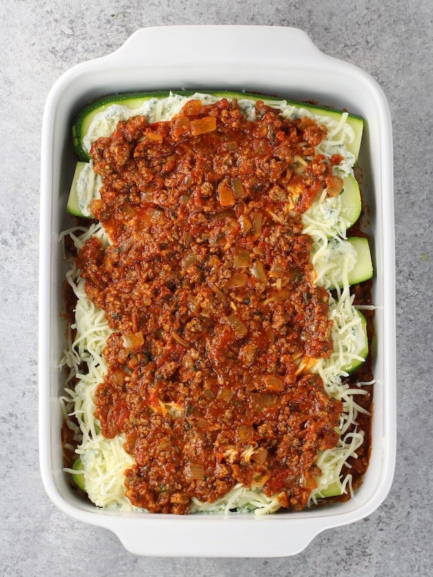 Casserole dish with layers of zucchini lasagna