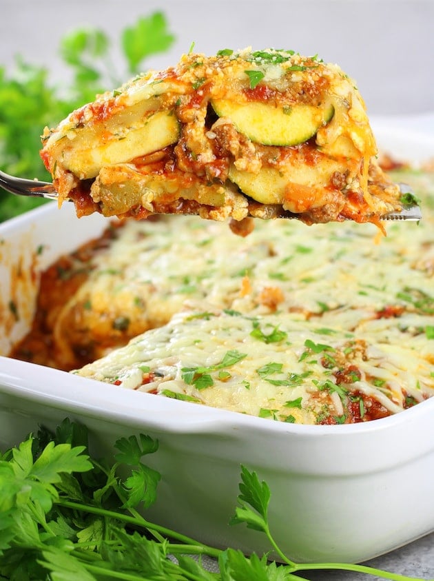 Spatula holding a serving of zucchini lasagna