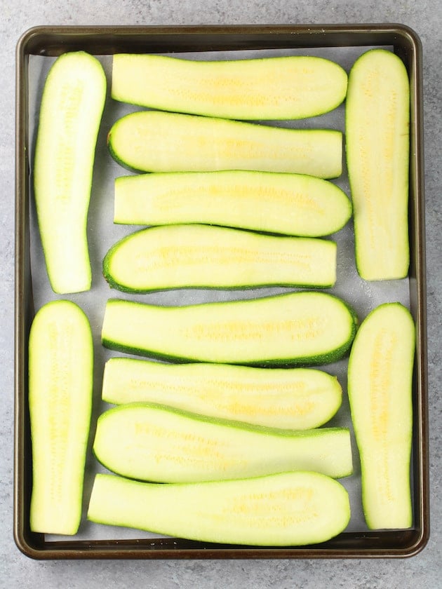 Sliced zucchini on a baking sheet