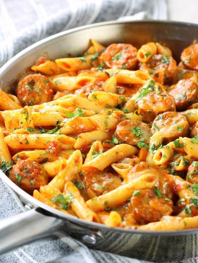 Penne pasta and chicken sausage in skille