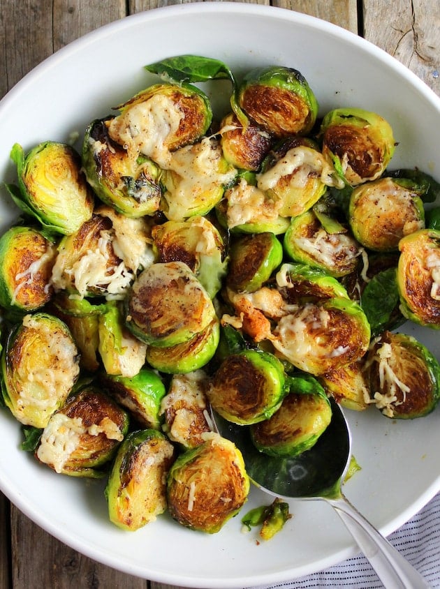 Asiago Cheese Brussels Sprouts in white serving dish