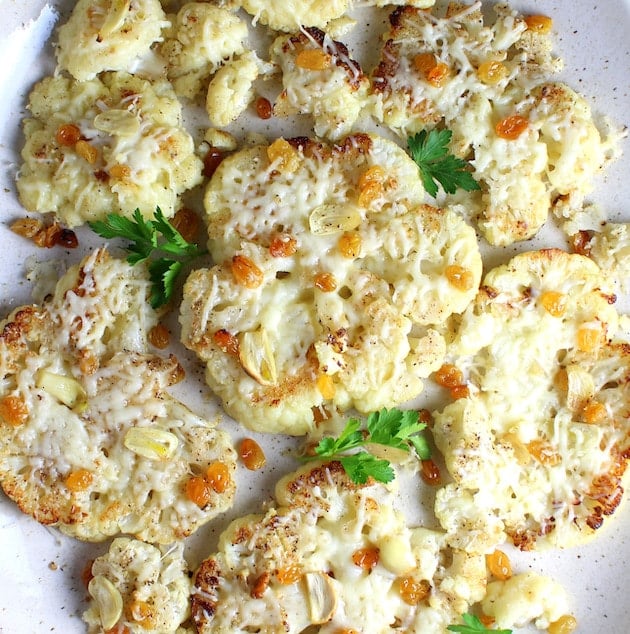 Roasted Cauliflower with melted Asiago italian cheese and golden raisins