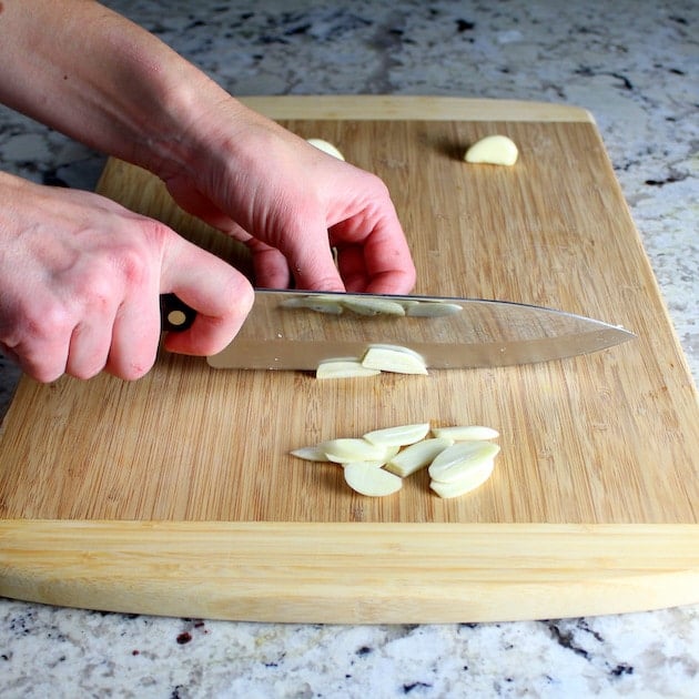 Slicing Garlic on cutting board