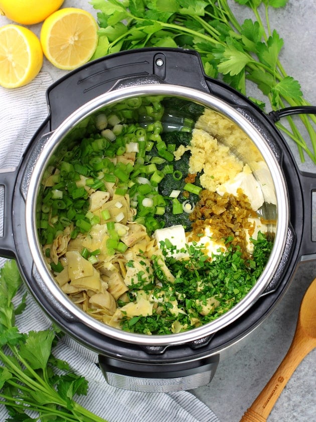 Artichoke and Spinach ingredients in Instant pot before cooking