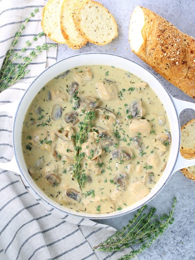 Creamy mushroom soup in a large white soup pot