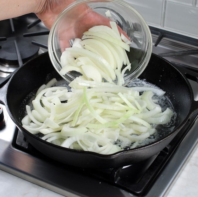 Adding onions to a cast iron skillet