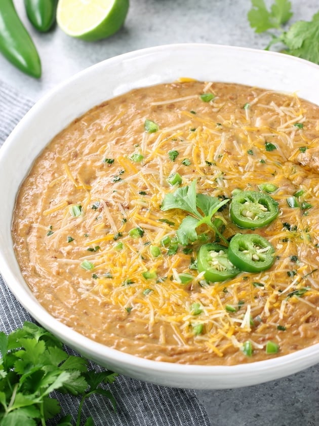 Bowl of refried beans with jalapenos