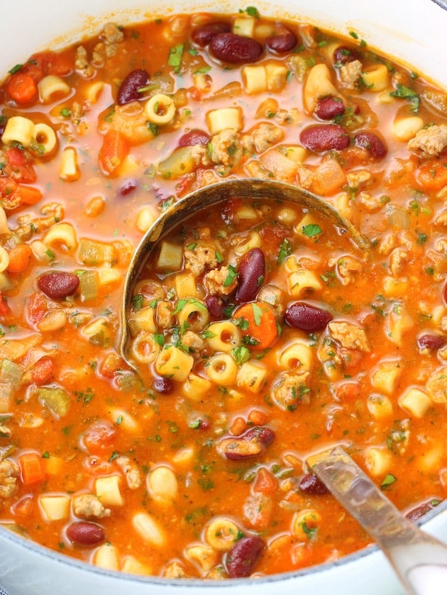 A bowl of soup with Pasta and Beans