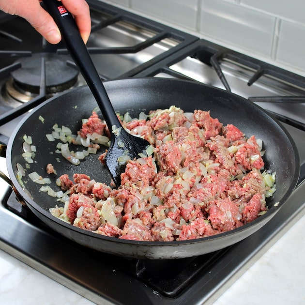 cooking ground beef in skillet for Million Dollar Spaghetti