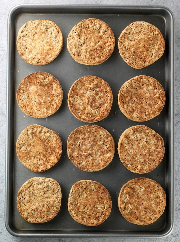 Toasted english muffins on a cookie sheet