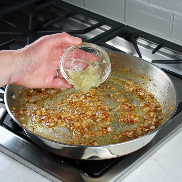 Adding garlic to a saute pan