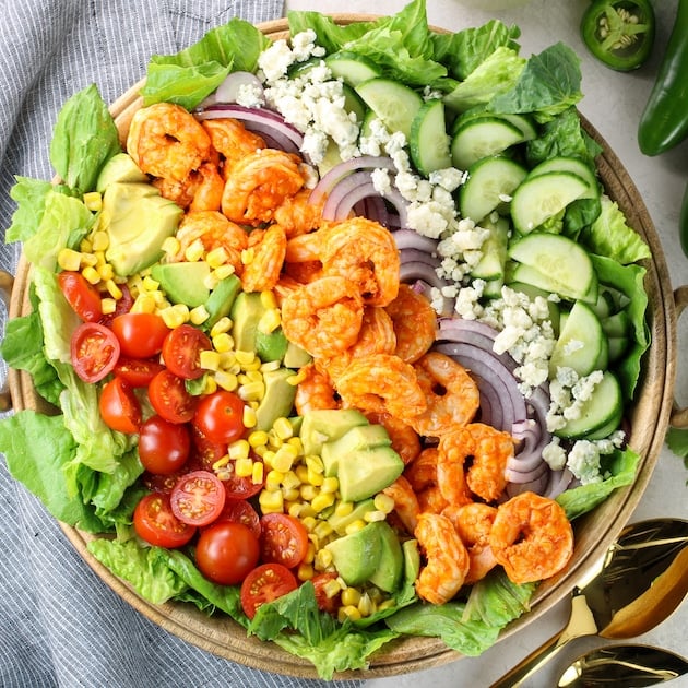 fresh veggie salad with buffalo shrimp