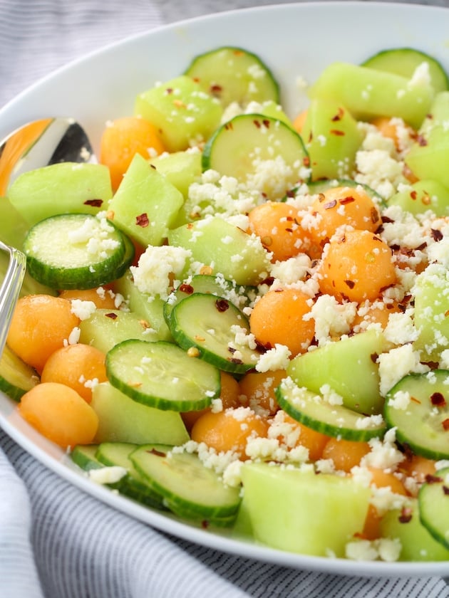 Eye level partial platter with cucumber melon salad