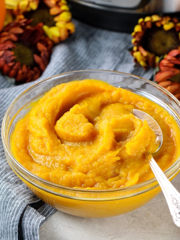 Bowl of pumpkin puree with spoon