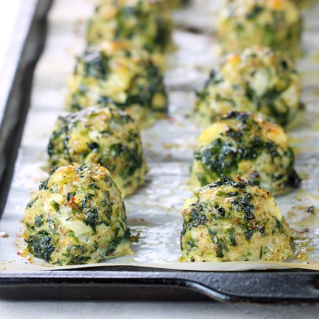 Baking sheet with spinach feta meatballs