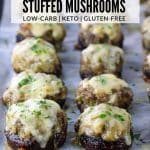 Baking sheet of stuffed mushrooms with melted cheese
