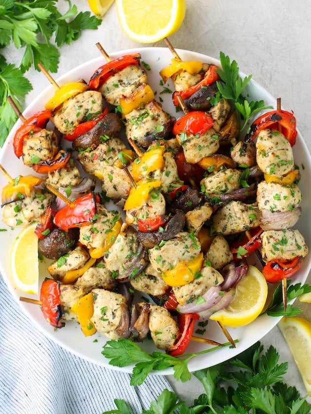 Platter of chicken kabobs with veggies