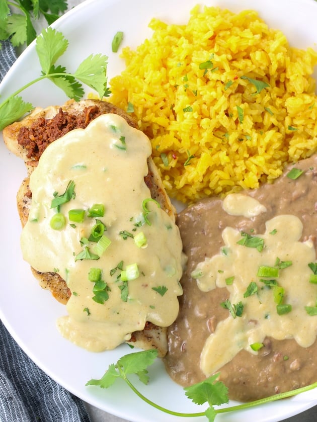 Grilled mexican chicken with rice and refried beans