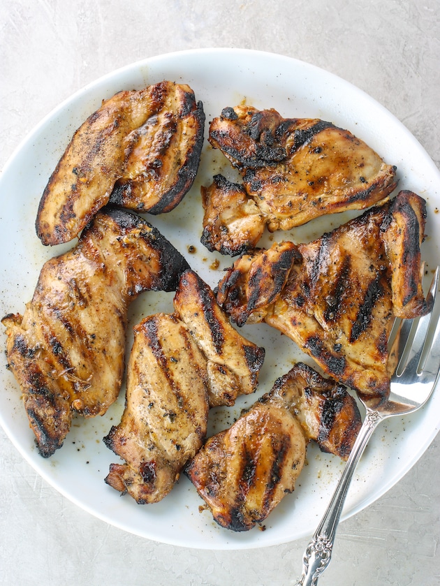 platter of grilled chicken thighs