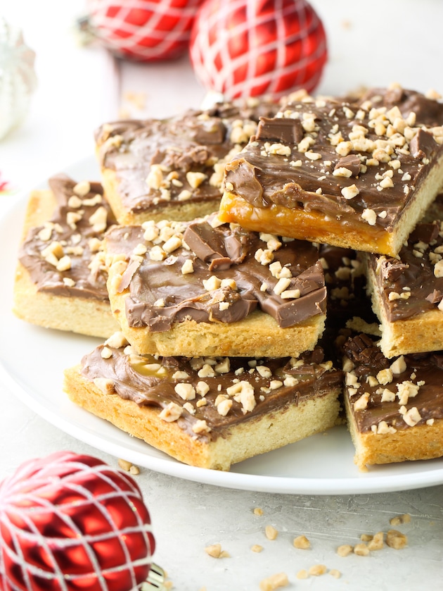 Chocolate Caramel Toffee Bars cut up on a plate.