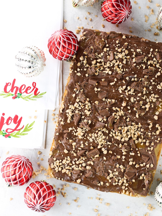 Chocolate Caramel Toffee Bars not cut with Christmas ornaments.