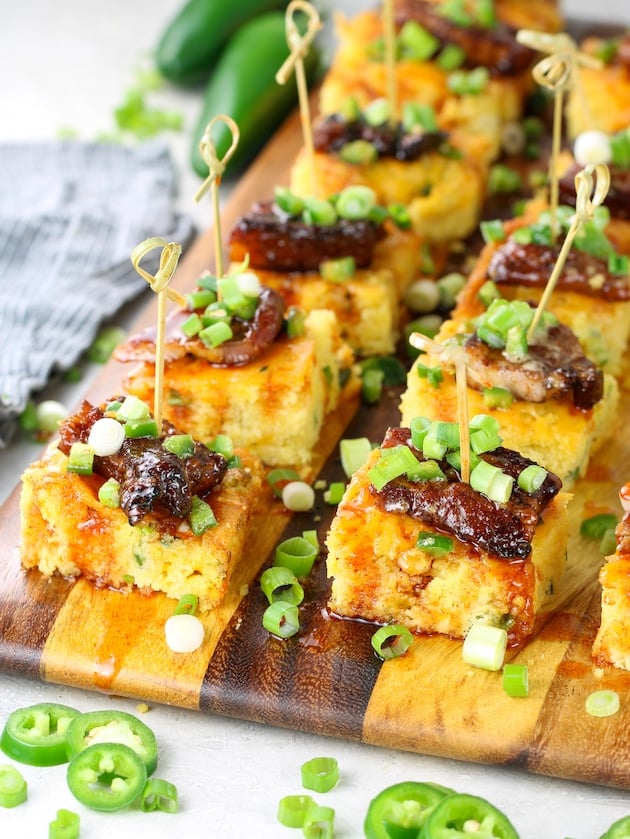 Appetizers of Crispy Pork Belly with Jalapeño Cheddar Cornbread and Hot Honey.