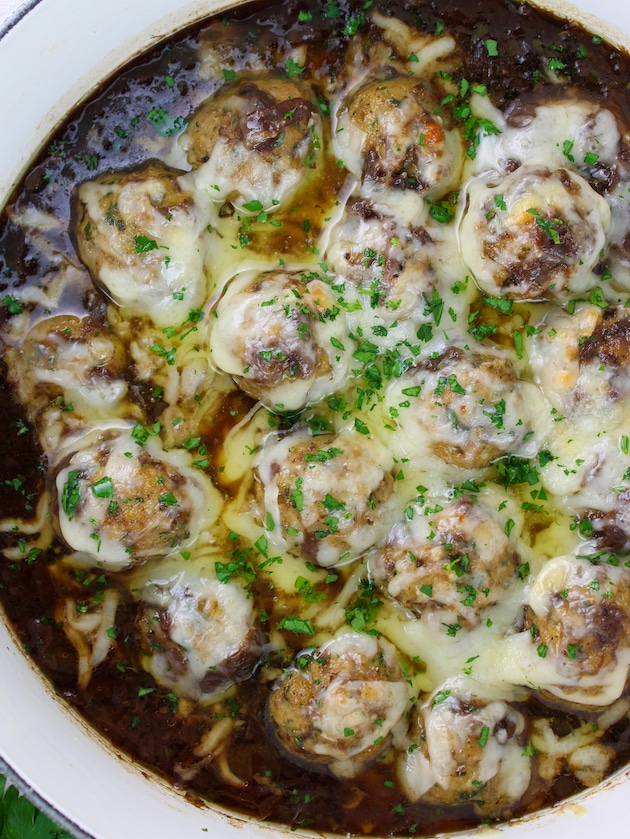 Low Carb French Onion Soup with Meatballs in half of a pot.