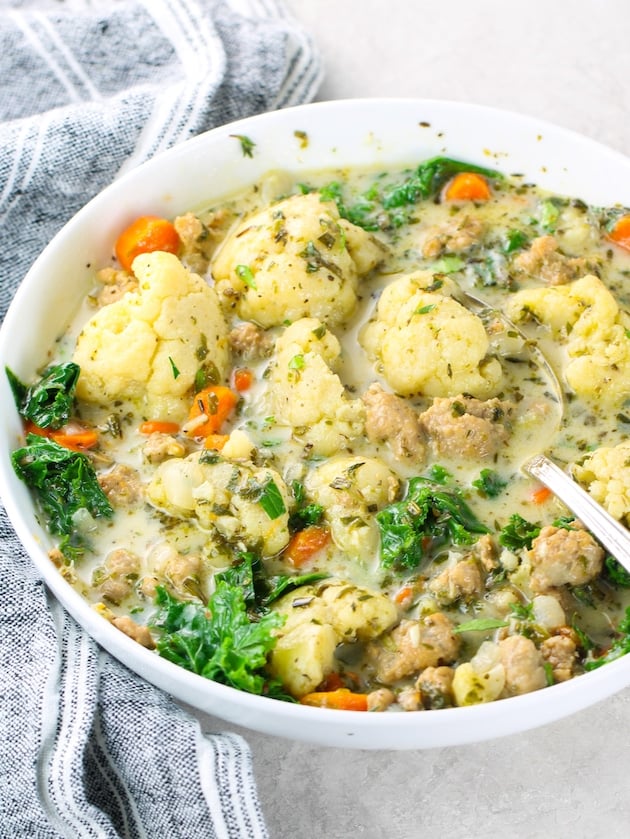 An eye level close up photo of low carb delicious looking Zuppa Toscano in a bowl.