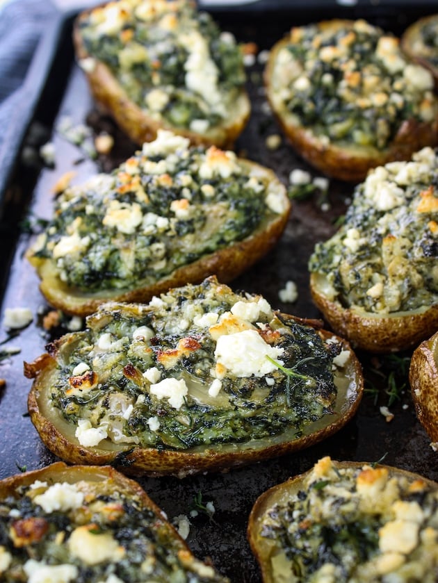 Twice baked potatoes stuffed with spinach, artichokes, and feta cheese.
