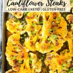 Sliced Cauliflower Steaks that have been roasted and topped with cheese, bacon, green onion, and sour cream. It's a low-carb and gluten-free side dish.