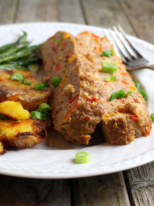 Gluten free meatloaf on plate with green beans and smashed potatoes 