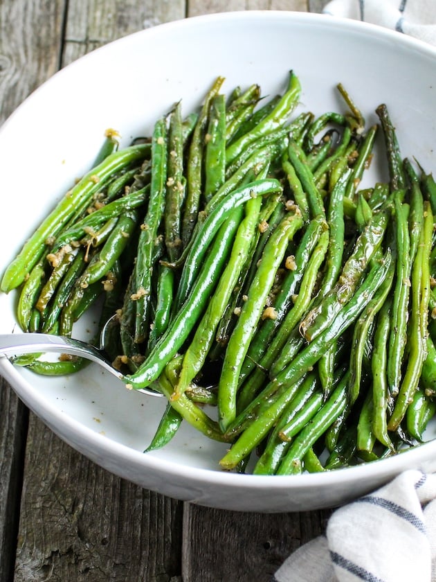 Easy Garlic French Green Beans in white serving dish