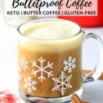 A festive holiday mug with snowflakes on it full of Cinnamon Keto Bulletproof Coffee.