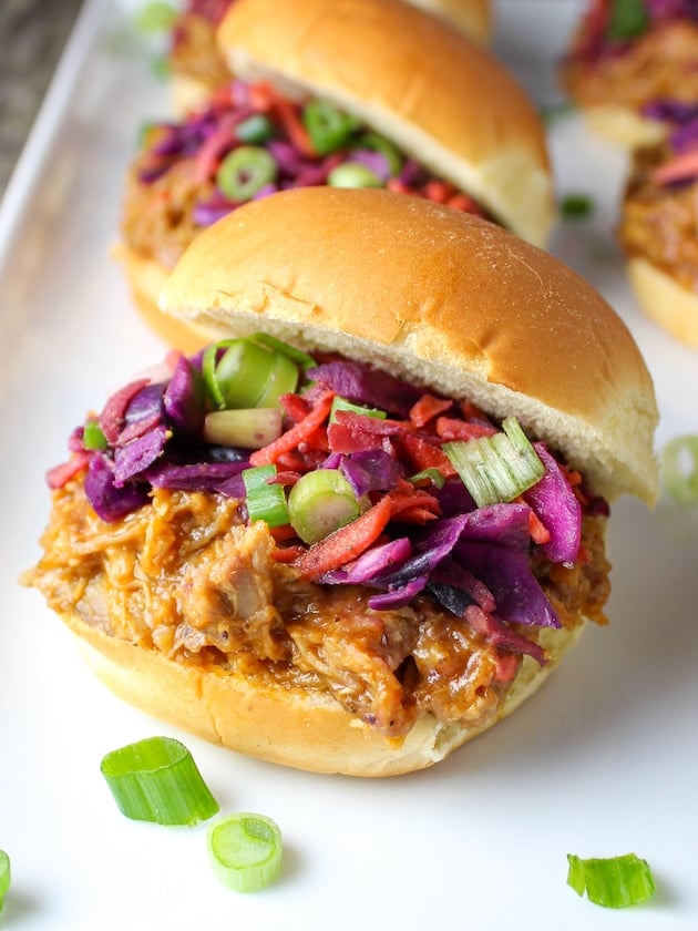 Pulled pork tossed in BBQ sauce on slider buns with warm and tangy coleslaw.