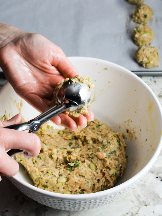 Forming chicken meatballs with a cookie scoop.