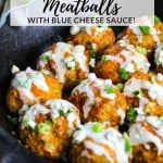 Buffalo Chicken Meatballs in a skillet drizzled with blue cheese sauce.