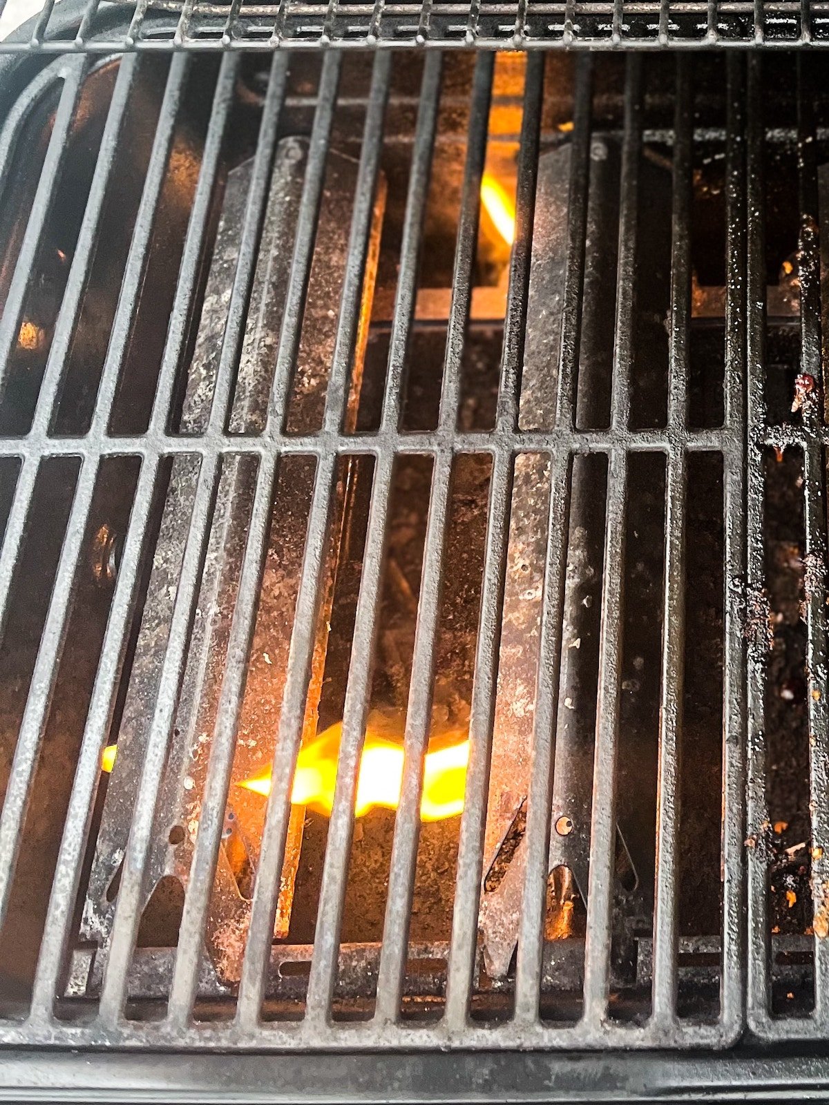 The side of the grill with the burners on.