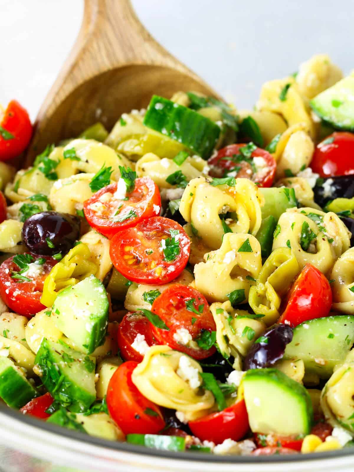A close-up photo of Greek pasta salad.